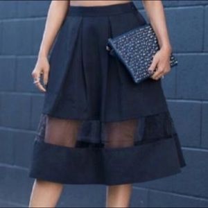 Express black midi skirt with mesh panel detail.